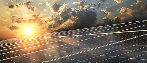 solar-panel-with-sunset-background_700x300px.jpg
